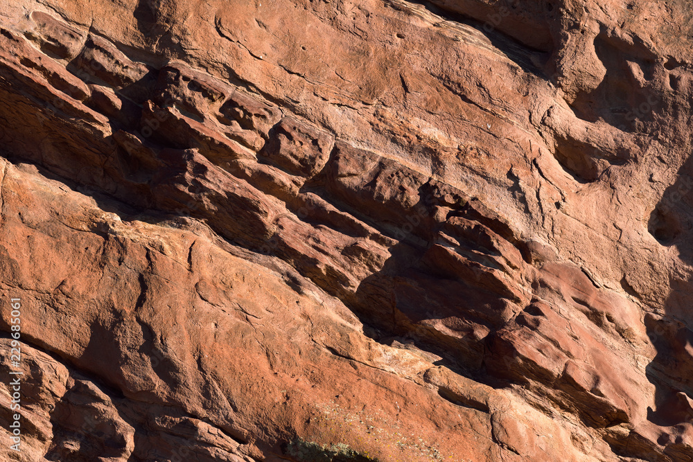 Red rock wind worn texture at sunrise Red rock wind worn texture at sunrise