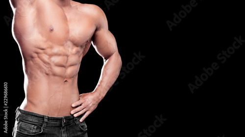 Strong Athletic Man muscular body, torso six pack abs, perfect male abdominal muscles close up. Sport, bodybuilding, crossfit concept.