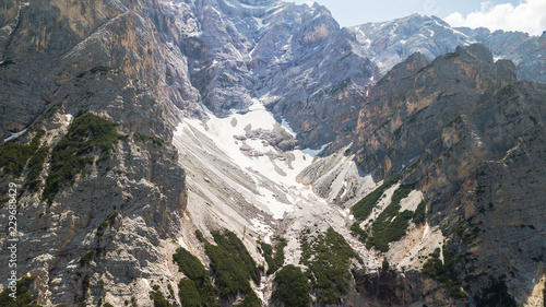Aerial view of the mudflow with snow high in the Alpine mountains