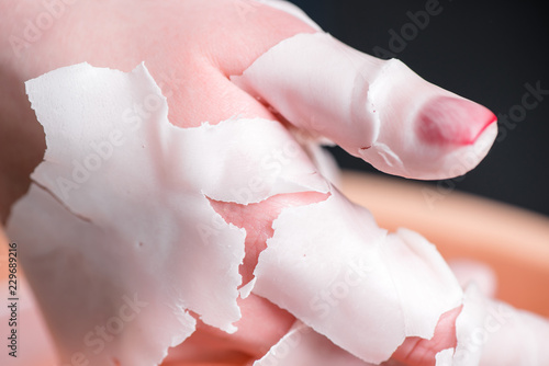 Process paraffin treatment of female hands in beauty salon