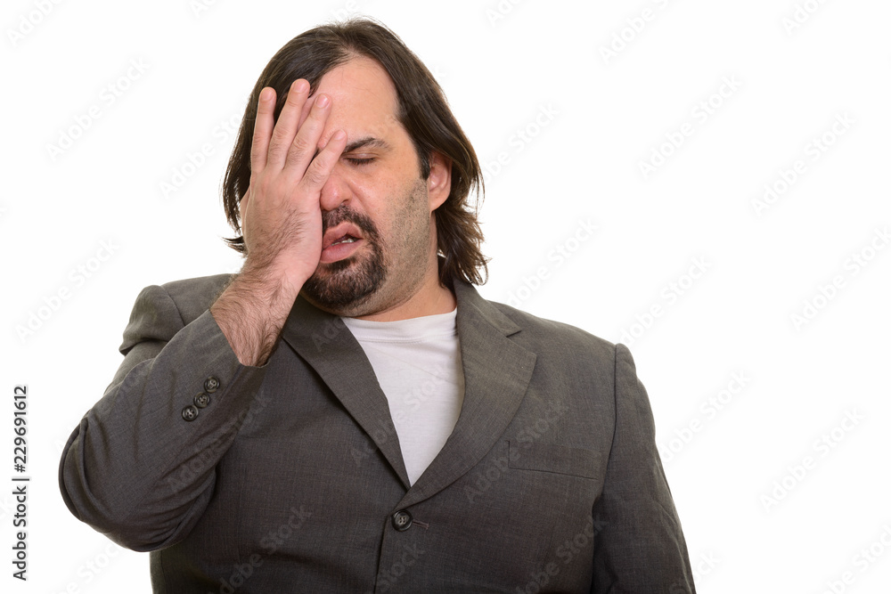 Portrait of stressed fat businessman looking tired Portrait of stressed fat businessman looking tired