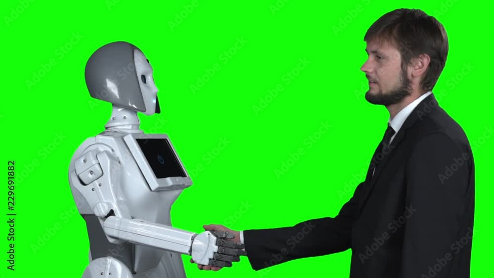 Robot shakes hands with a guy greets him. Green screen. Slow motion Robot shakes hands with a guy greets him. Green screen. Slow motion