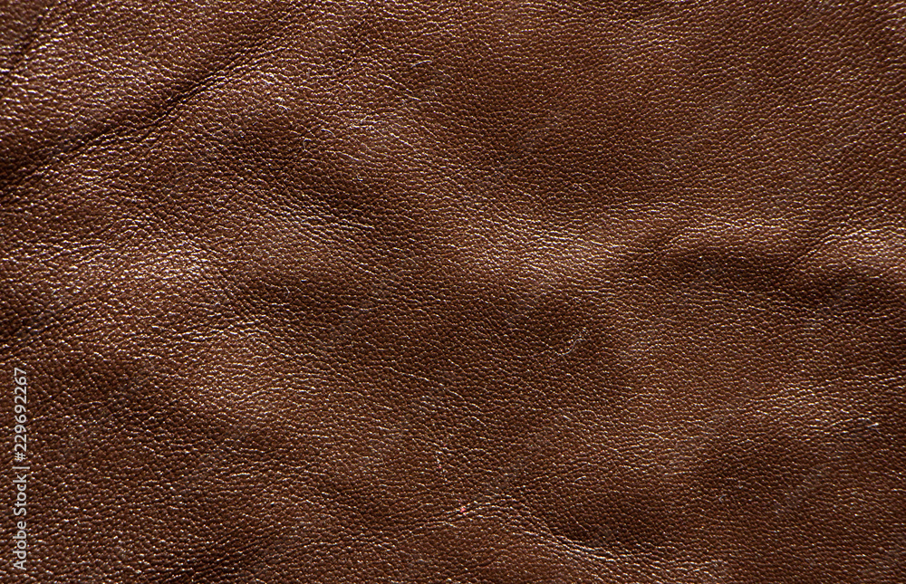 Brown skin texture close up. Natural, environmentally friendly material Brown skin texture close up. Natural, environmentally friendly material