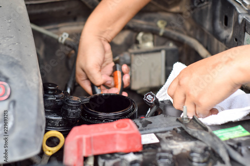 Engineers are repairing engines with tools.