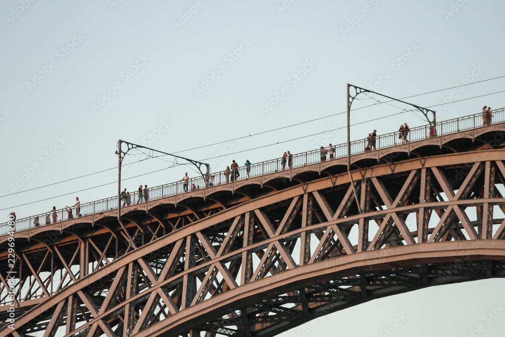 Zoom of Dom Luiz bridge at spring , Porto , Portugal. Vintage colored picture Travel background Zoom of Dom Luiz bridge at spring , Porto , Portugal. Vintage colored picture Travel background