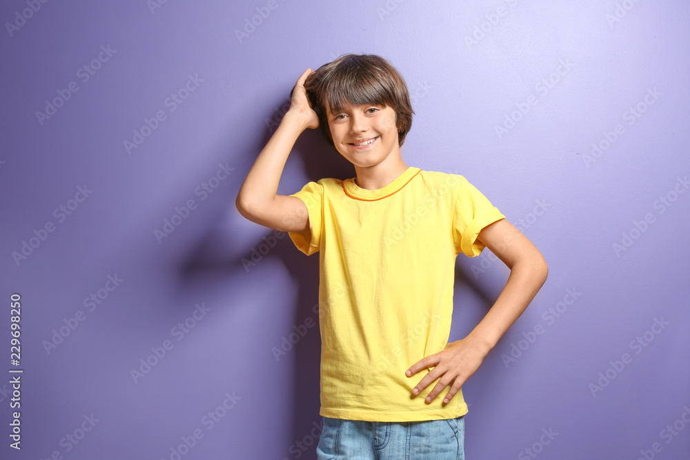Smiling little boy in t-shirt on color background Smiling little boy in t-shirt on color background