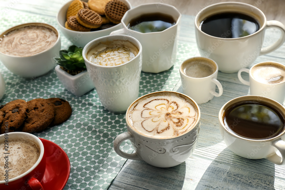 Many cups with tasty aromatic coffee on table Many cups with tasty aromatic coffee on table
