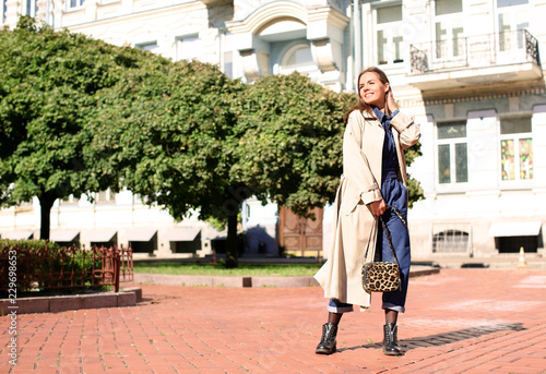 Fashionable young woman out...