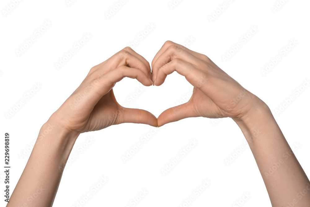 Woman making heart with her hands on white background Woman making heart with her hands on white background
