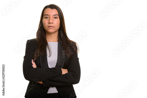 Young beautiful Caucasian businesswoman with arms crossed