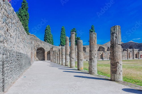 Ruins of houses and columns in Pompei, Italy