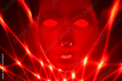 Red dramatic mask stock images. Red mask on a red background. Plastic human mask. Blank male mask Halloween. Mental illness abstract picture stock images