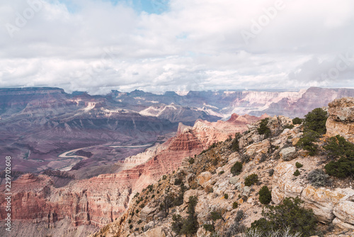 Picturesque view of Grand Canyon on blue sky background