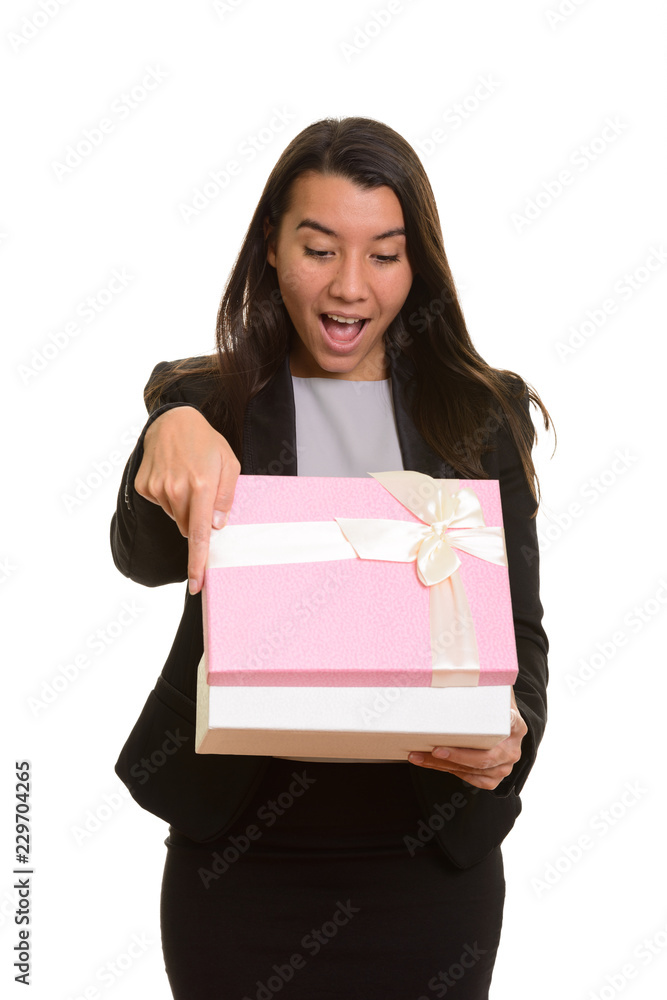 Young happy Caucasian businesswoman smiling and opening gift box Young happy Caucasian businesswoman smiling and opening gift box