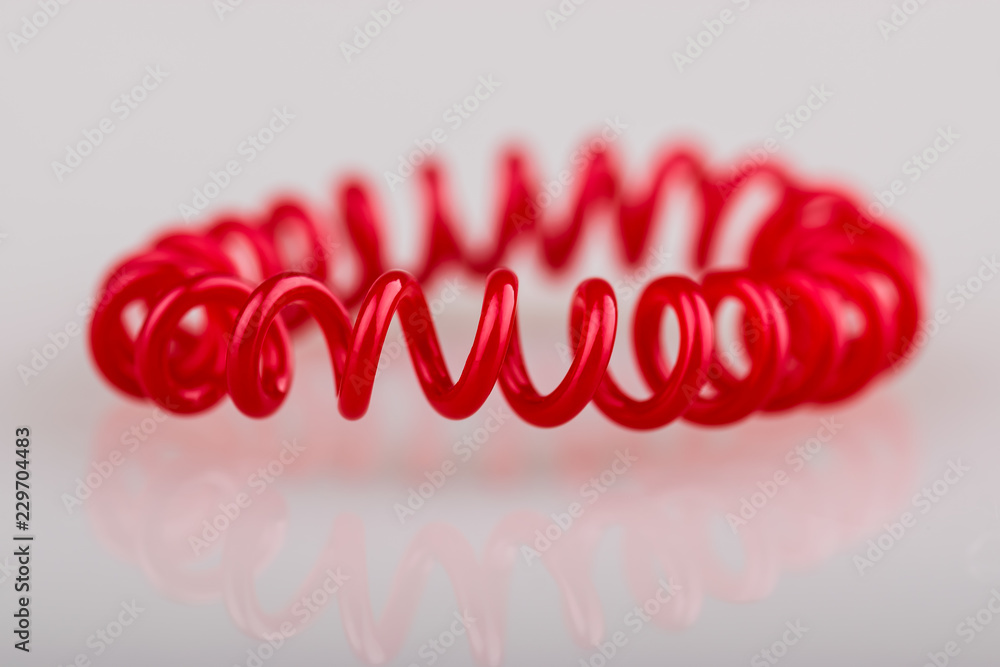 Red spiral on white background. Scrunchy Red spiral on white background. Scrunchy