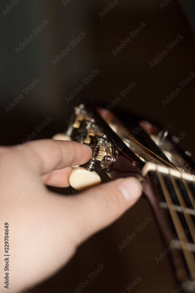 Close up shot sound hole and strings of acoustic guitar Close up shot sound hole and strings of acoustic guitar