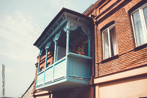 Old Tbilisi architecture, windows and balcony exterior decor in summer day