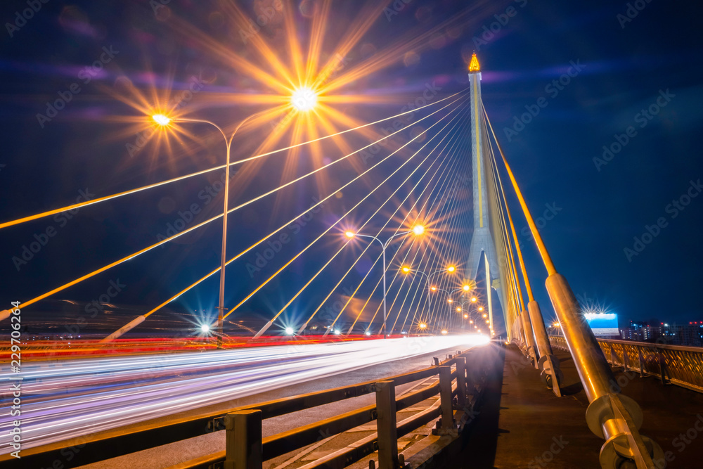 Obraz premium Landscape Rama 8 Bridge at night. a bridge across the Chao Phraya River. In Bangkok Thailand. It is a beautiful place and a landmark of the country.
