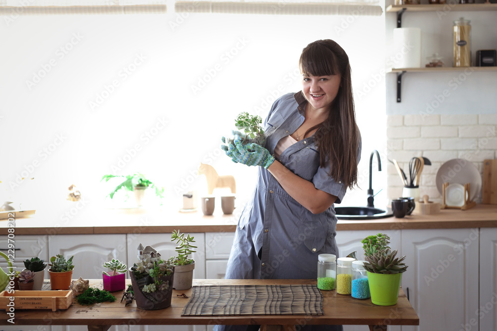 glass terrarium in hands of florist, hobby glass terrarium in hands of florist, hobby