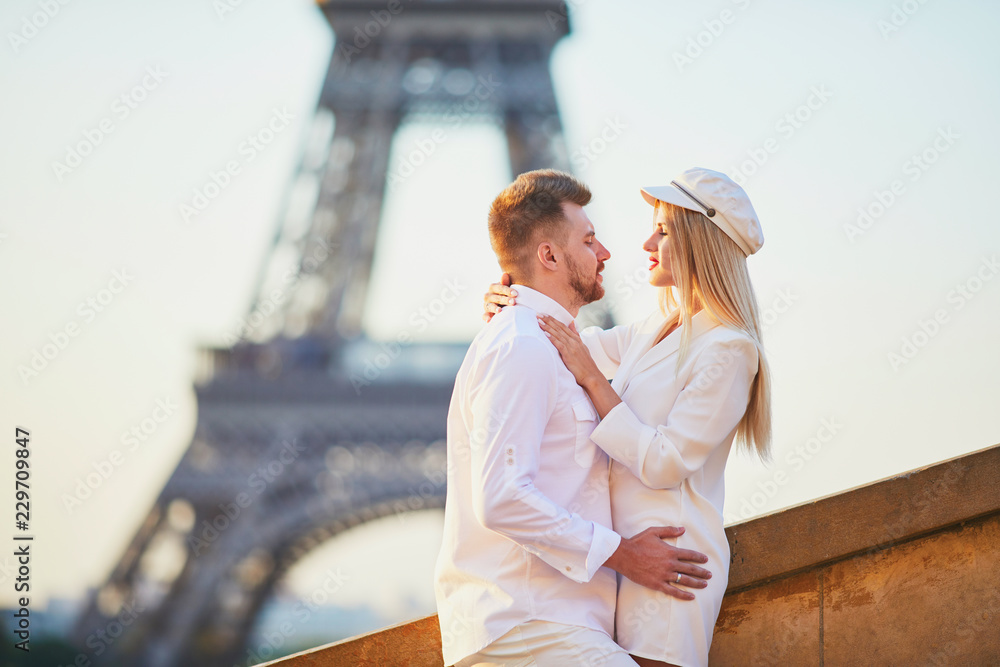 Romantic couple having a date near the Eiffel tower Romantic couple having a date near the Eiffel tower