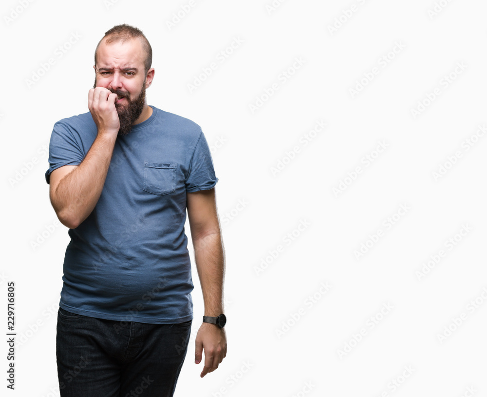 Young caucasian hipster man over isolated background looking stressed and nervous with hands on mouth biting nails. Anxiety problem. Young caucasian hipster man over isolated background looking stressed and nervous with hands on mouth biting nails. Anxiety problem.