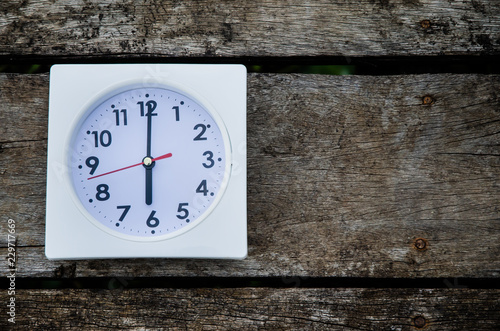 Wallpaper Mural White clock on the wooden floor in the morning.On the floor there is a watch on it. Torontodigital.ca