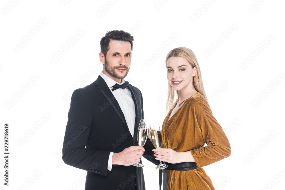 portrait of attaractive couple clinking glasses of champagne isolated on white portrait of attaractive couple clinking glasses of champagne isolated on white