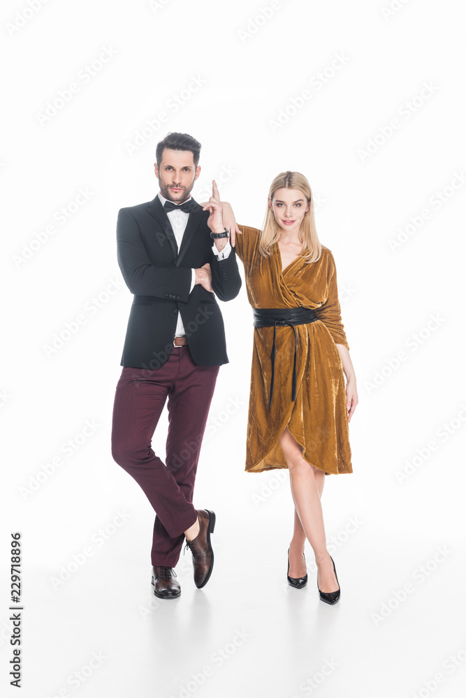 young attractive couple in stylish clothing isolated on white young attractive couple in stylish clothing isolated on white