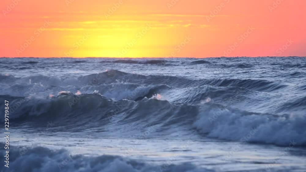Dark blue sea water of the ocean against the background of the red dawn sunset sky. Sea landscape scenery country scene background. Natural ocean backdrop summer concept Dark blue sea water of the ocean against the background of the red dawn sunset sky. Sea landscape scenery country scene background. Natural ocean backdrop summer concept