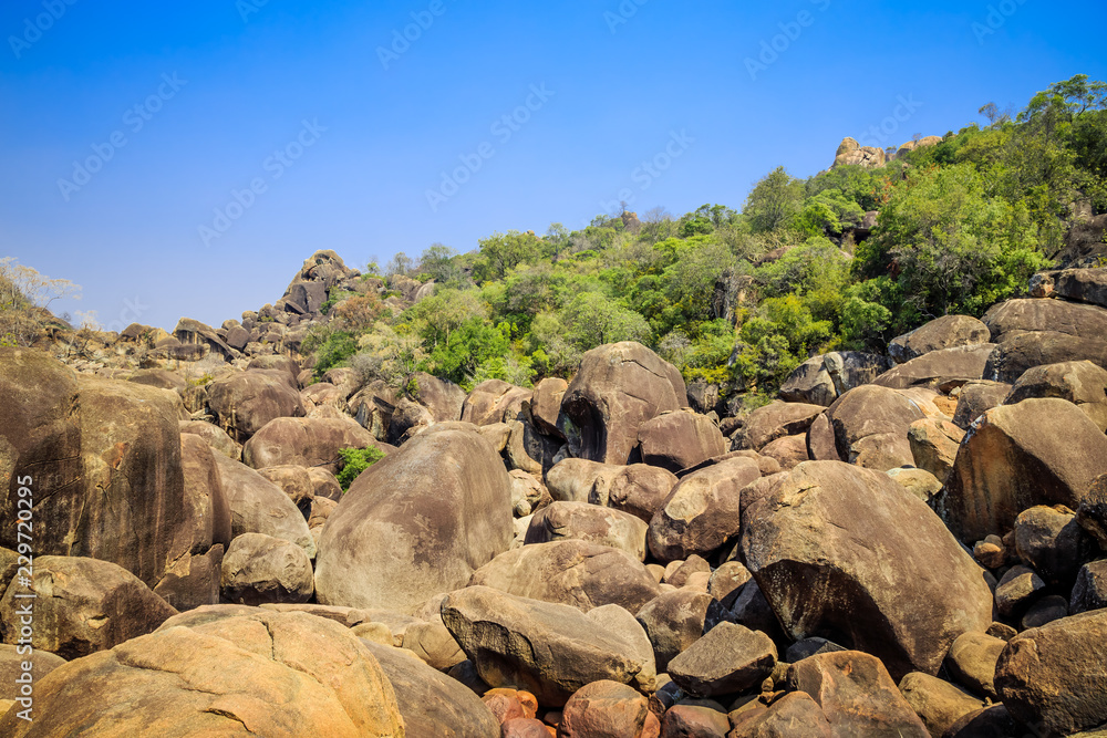 Fallen boulders in Matobo National Park, Zimbabwe, formed by millions of years of erosion. September 11, 2016.