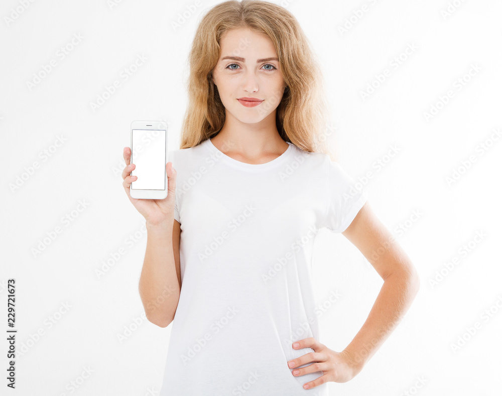 cute sexy woman in t shirt hold blank screen cell phone isolated on white background. Arm holding smartphone, copy space