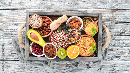 Various superfoods. In a wooden box. Top view. Free copy space.