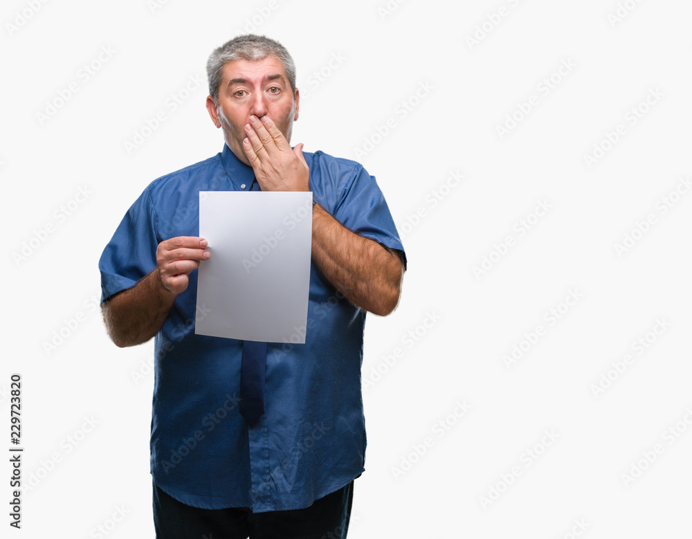 Handsome senior man holding blank sheet paper over isolated background cover mouth with hand shocked with shame for mistake, expression of fear, scared in silence, secret concept Handsome senior man holding blank sheet paper over isolated background cover mouth with hand shocked with shame for mistake, expression of fear, scared in silence, secret concept