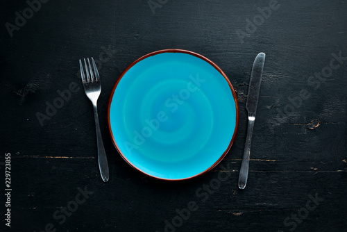 Creative Dinner Plates on Wooden background. Free space for your text. Top view.