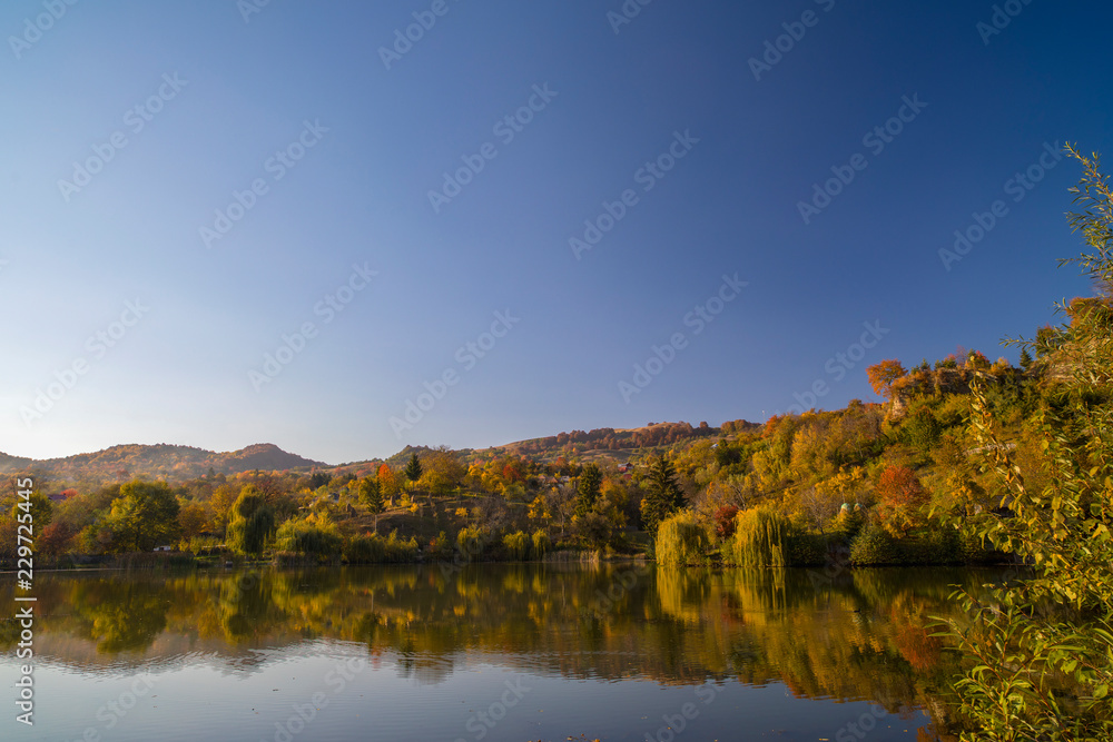 Beautiful landscape Autumn forest and lake in the fall season. Beautiful landscape Autumn forest and lake in the fall season.