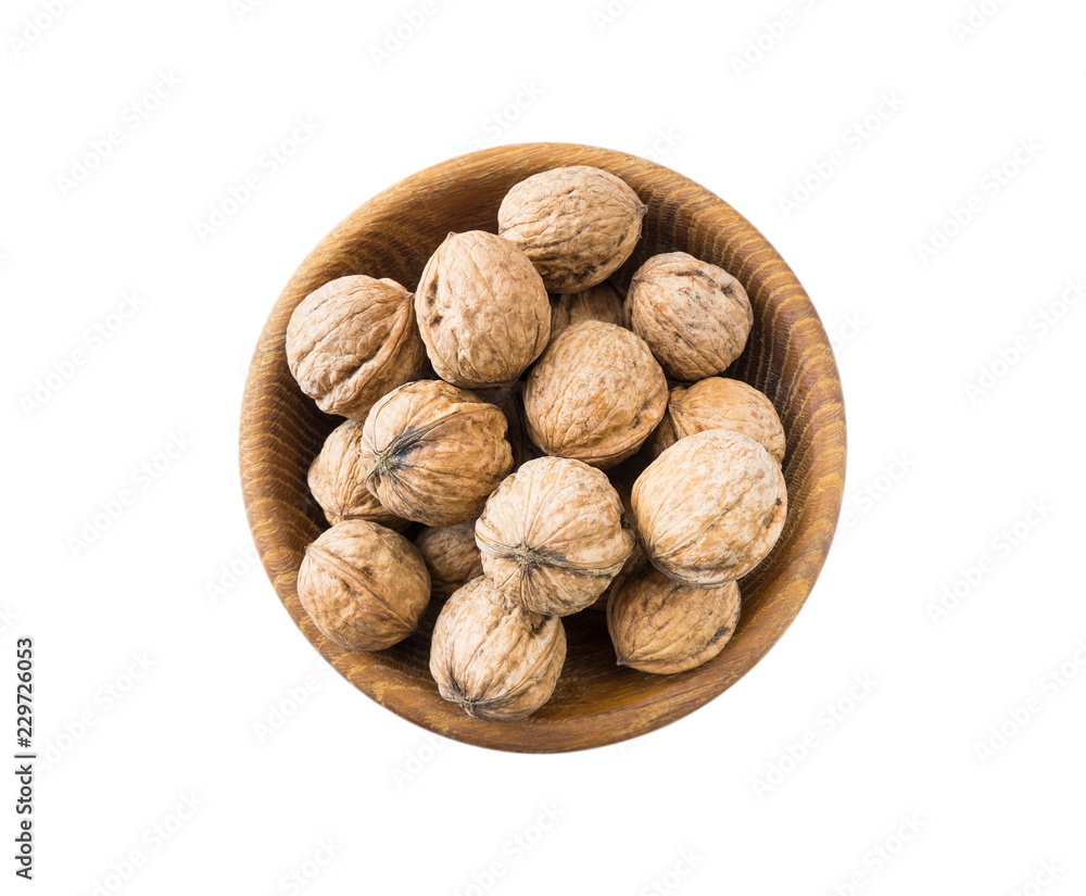 Walnuts isolated on white. Walnuts in a bowl isolated on white background. Walnuts with copy space for text on a white background Walnuts isolated on white. Walnuts in a bowl isolated on white background. Walnuts with copy space for text on a white background