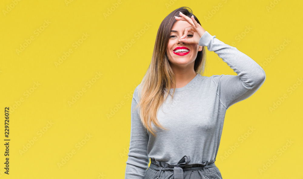 Young beautiful worker business woman over isolated background doing ok gesture with hand smiling, eye looking through fingers with happy face. Young beautiful worker business woman over isolated background doing ok gesture with hand smiling, eye looking through fingers with happy face.
