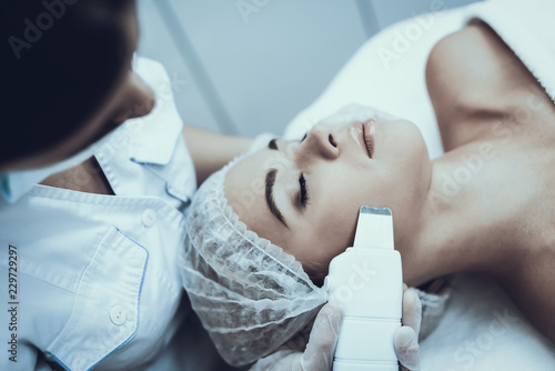 Young Woman in Spa Salon for Laser Hair Removal.