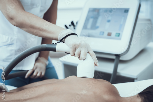 Young Man in Spa Salon for Laser Hair Removal.