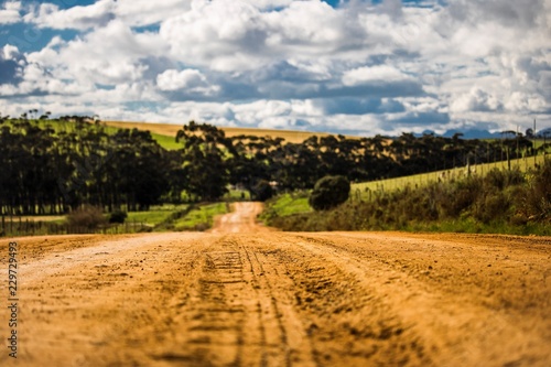 Dirt road through agricultural fields in Napier, Western Cape, South Africa.