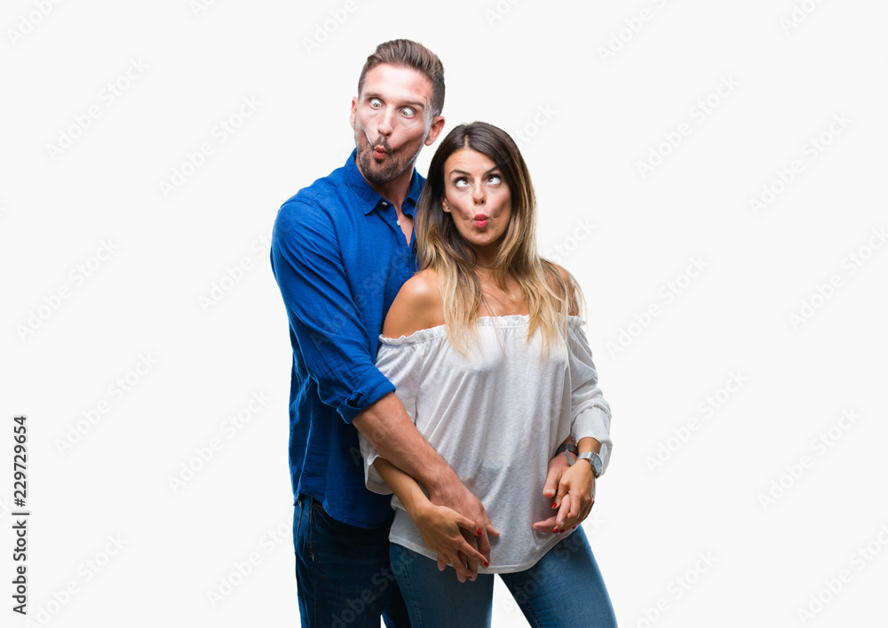 Young couple in love over isolated background making fish face with lips, crazy and comical gesture. Funny expression. Young couple in love over isolated background making fish face with lips, crazy and comical gesture. Funny expression.
