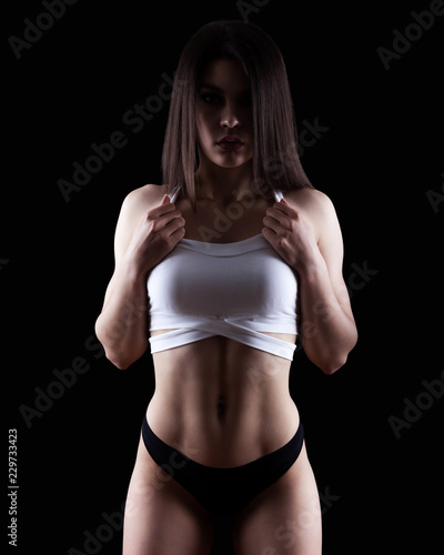 Young athletic, gym, fitness woman