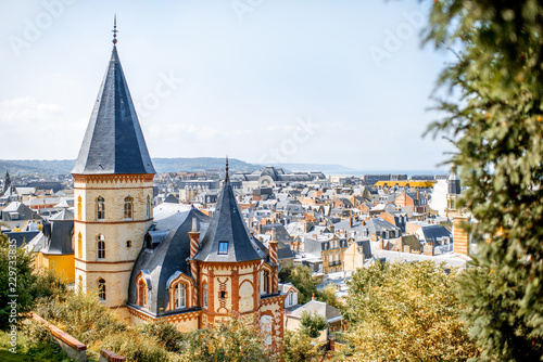 Top view of Trouville city with rooftops of luxury houses and ocean on the background in France photo