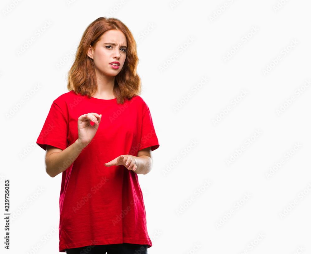 Young beautiful woman over isolated background disgusted expression, displeased and fearful doing disgust face because aversion reaction. With hands raised. Annoying concept. Young beautiful woman over isolated background disgusted expression, displeased and fearful doing disgust face because aversion reaction. With hands raised. Annoying concept.