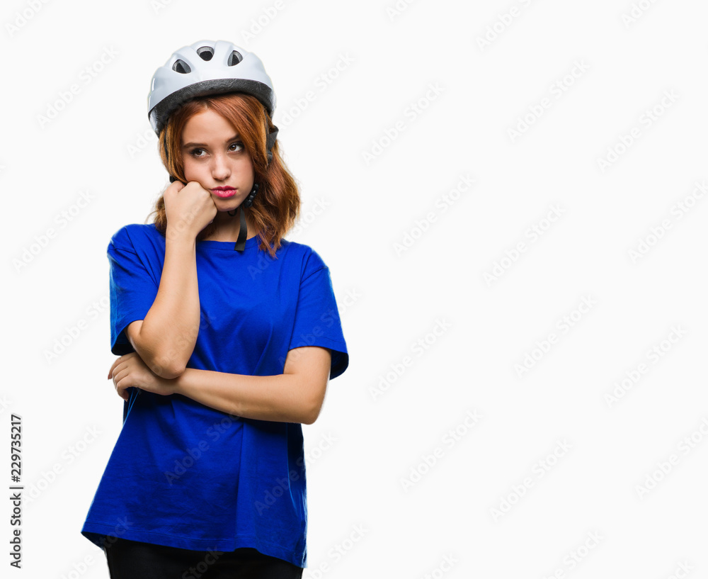 Young beautiful woman wearing cyclist helmet over isolated background thinking looking tired and bored with depression problems with crossed arms. Young beautiful woman wearing cyclist helmet over isolated background thinking looking tired and bored with depression problems with crossed arms.