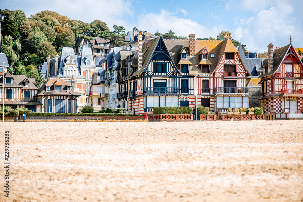 View on the cooastline with sandy beach and luxury buildings in Trouville, famous french town in Normandy View on the cooastline with sandy beach and luxury buildings in Trouville, famous french town in Normandy