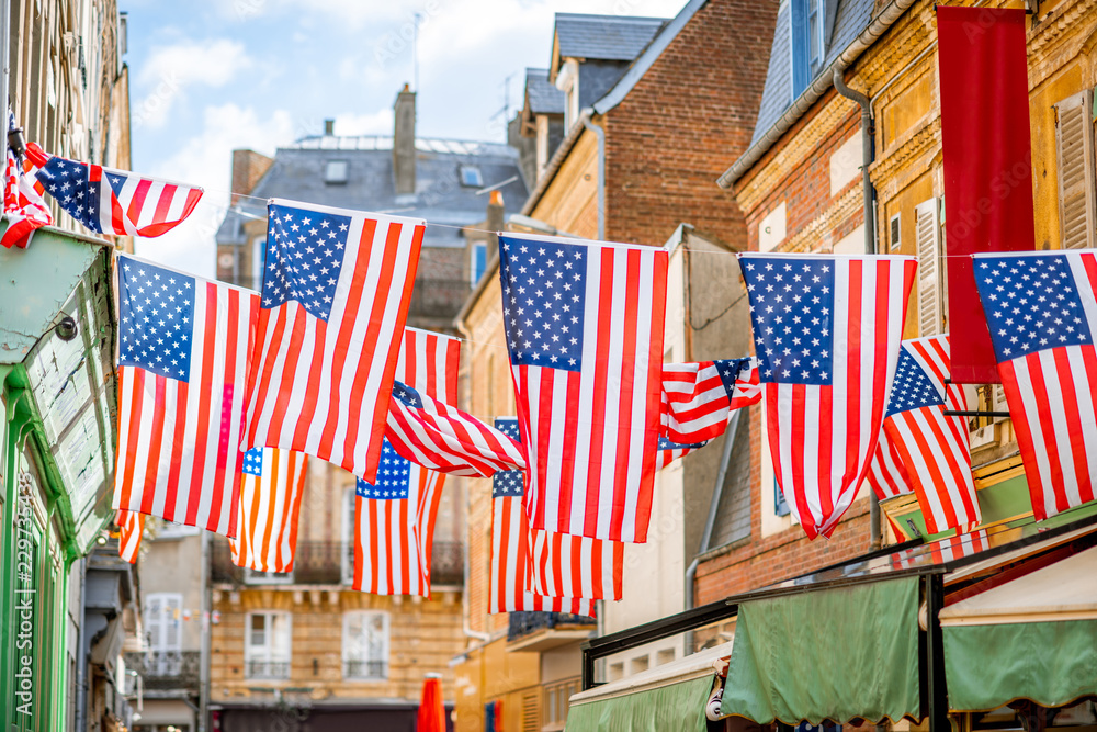 Big american flags on the street of the old town
