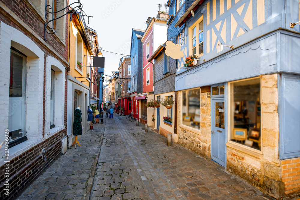 Street view with ancient wooden buildings in Honfleur, famous french town in Normandy