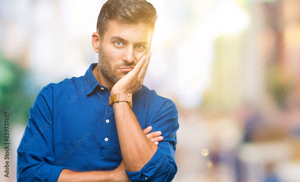 Young handsome man over isolated background thinking looking tired and bored with depression problems with crossed arms. Young handsome man over isolated background thinking looking tired and bored with depression problems with crossed arms.