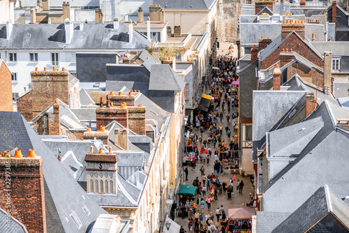 Fototapeta Naklejka Na Ścianę i Meble -  Aerial citysape view of Rouen with central pedestrian street crowded with people in Normandy, France